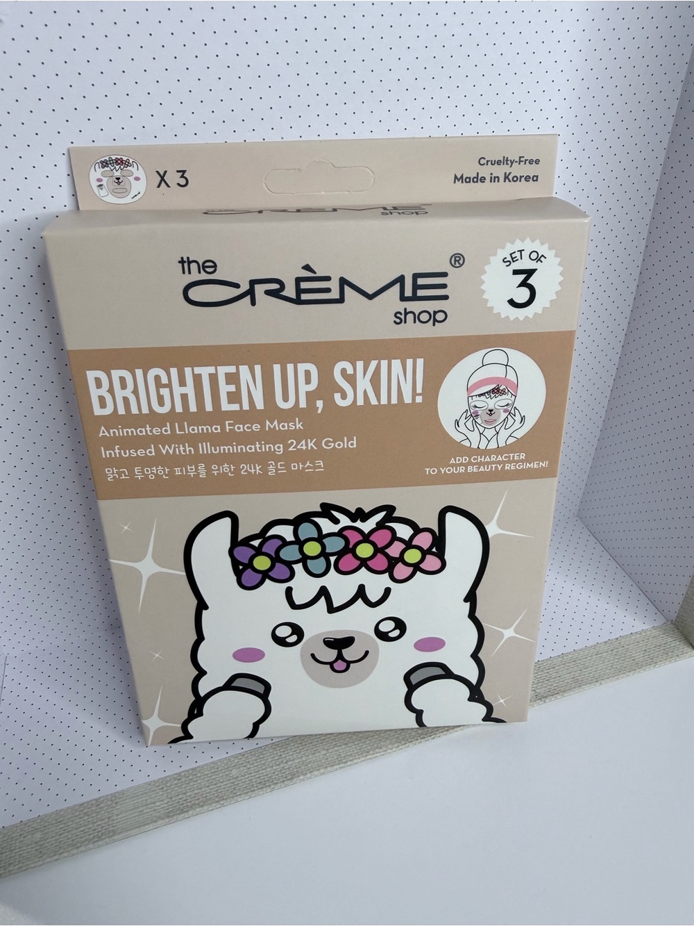 Brighten Up, Skin! Animated Llama Face Mask infused with illuminating 24k gold